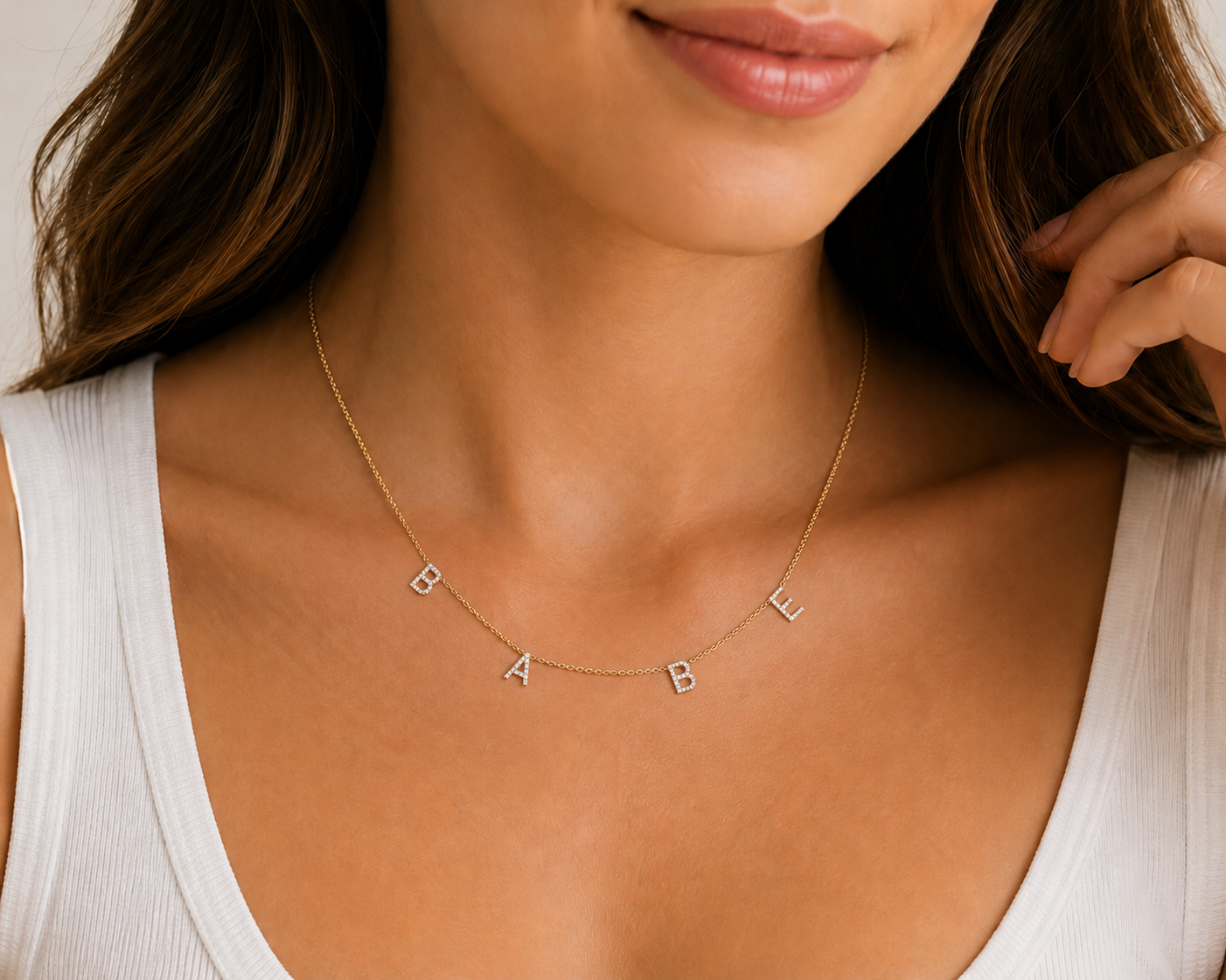 Model wearing a personalized 14K gold natural diamond initial necklace