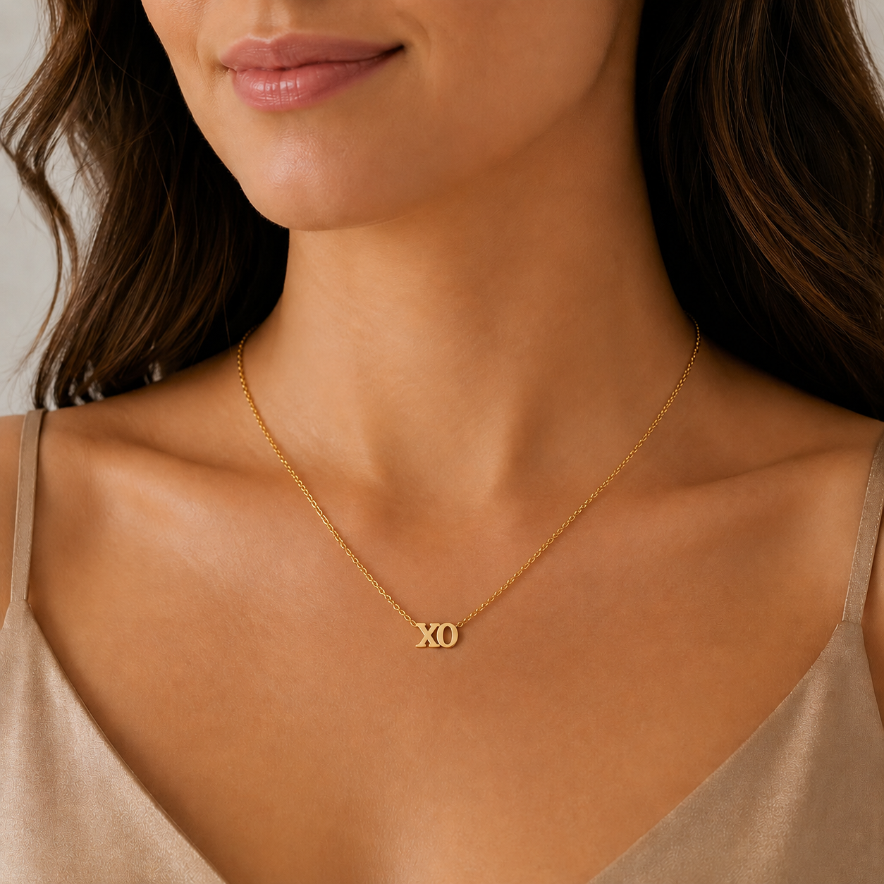 14K solid gold XO necklace in yellow gold on a delicate cable chain, available in yellow, white, and rose gold.